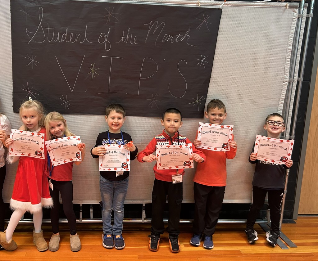 december students of the month holding certificate 