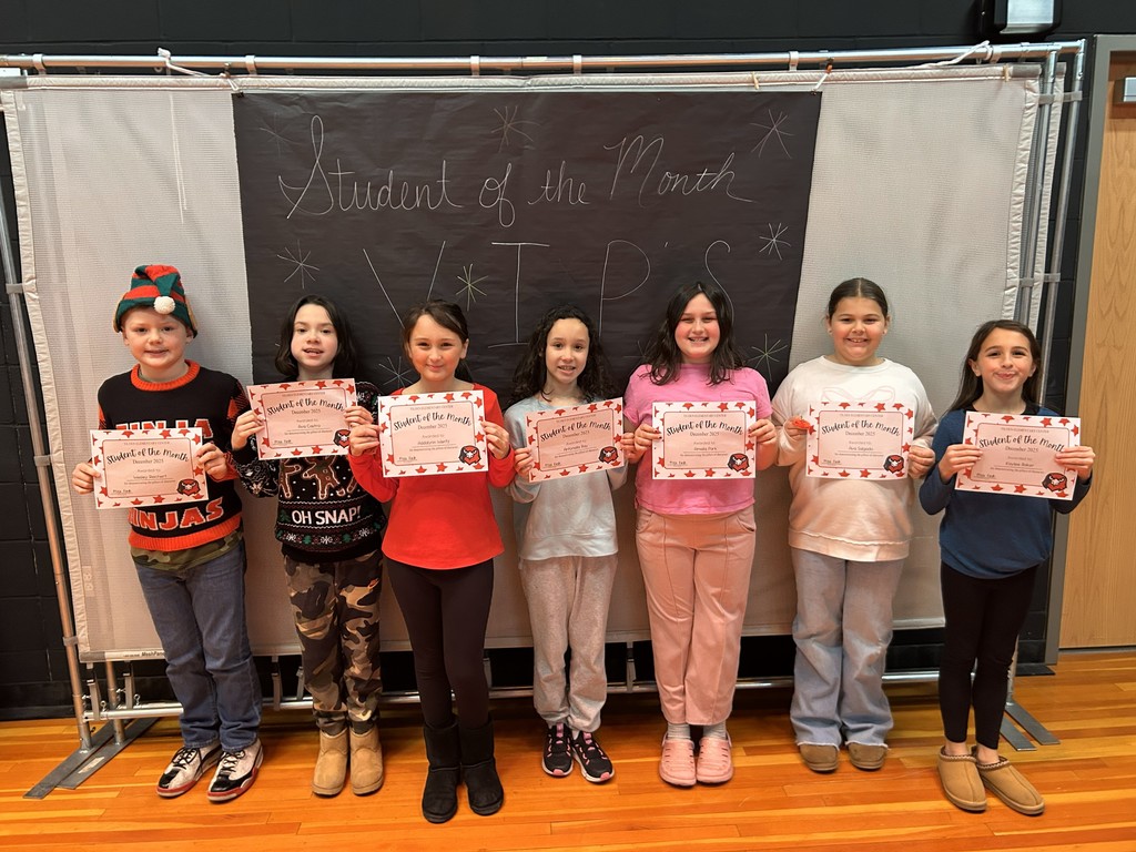 december students of the month holding certificate 