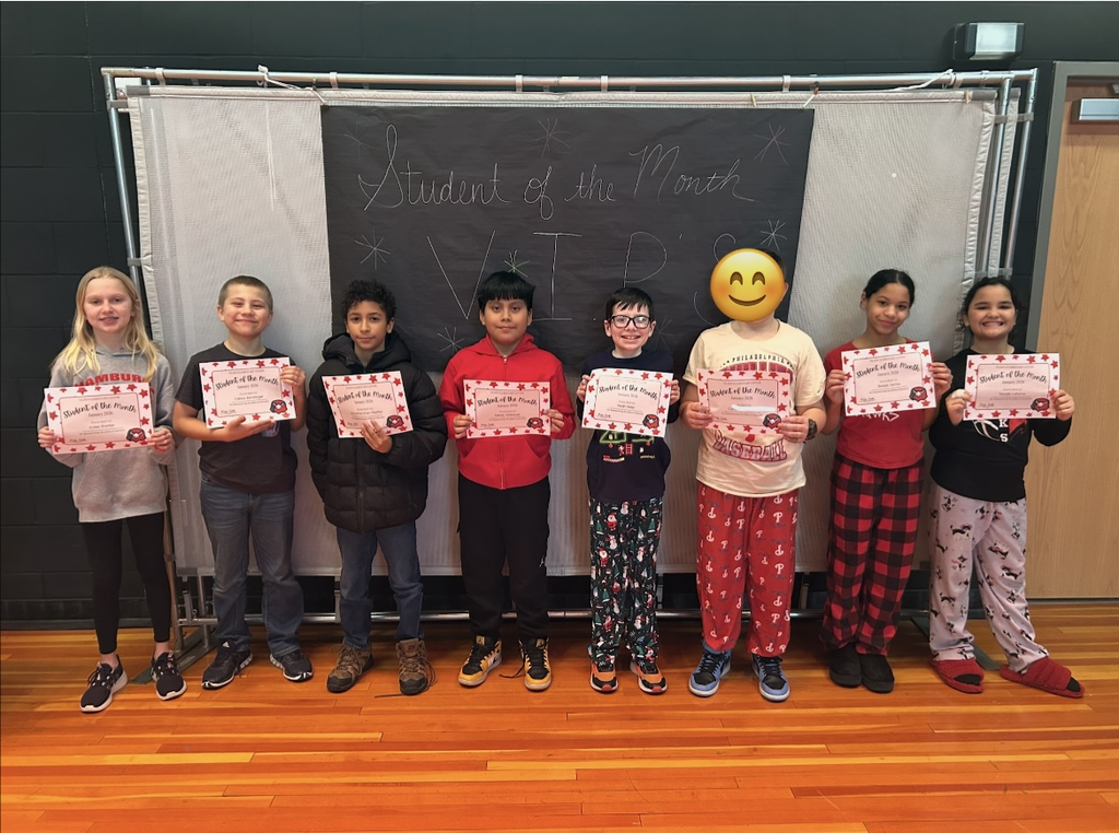 January Students of the month standing with certificate
