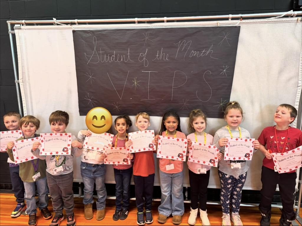 January Students of the month standing with certificate