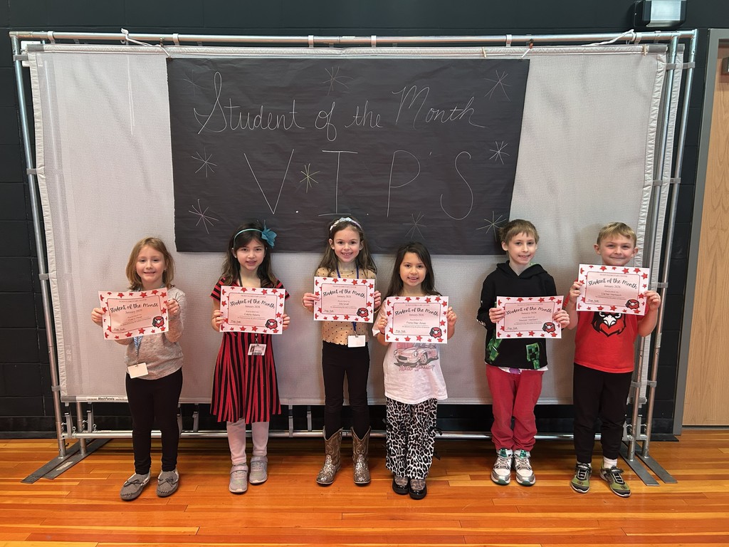 January Students of the month standing with certificate