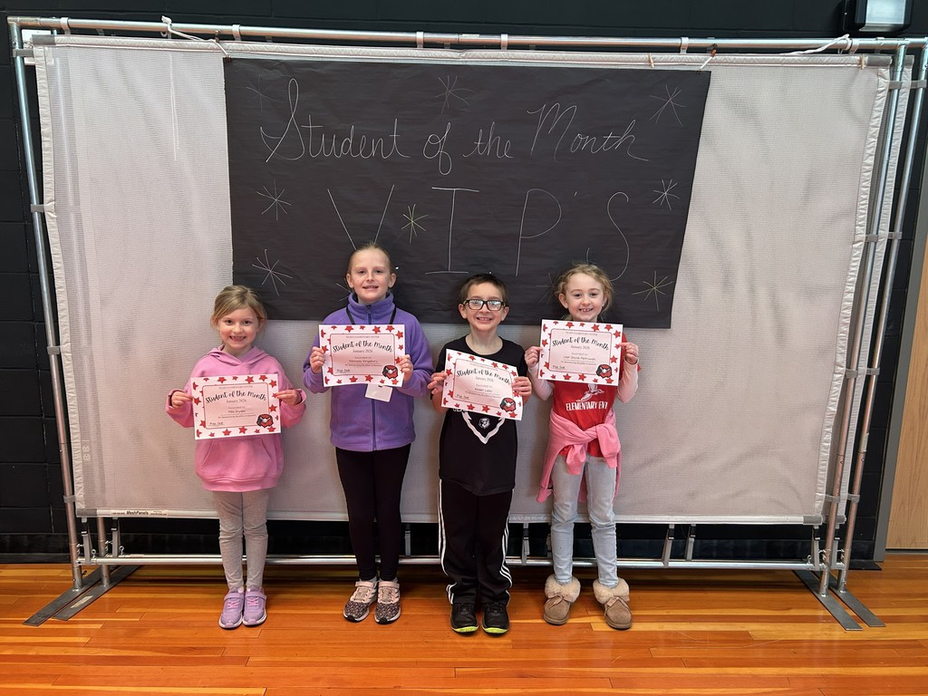 January Students of the month standing with certificate