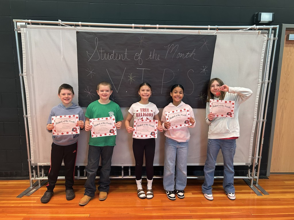 January Students of the month standing with certificate