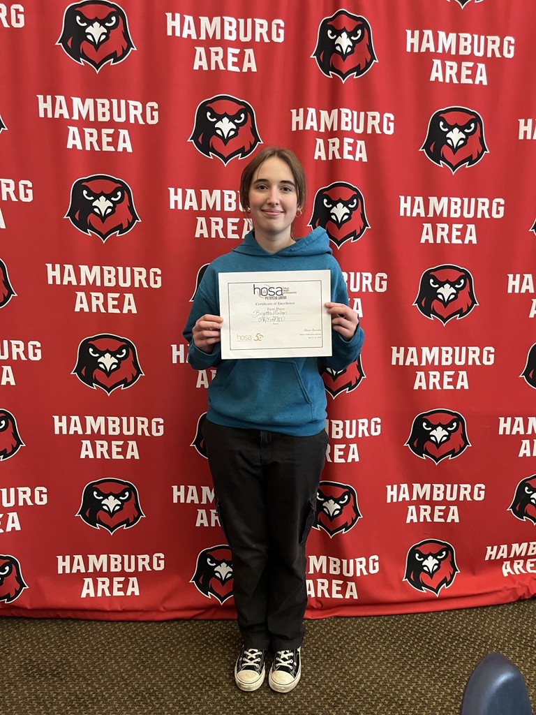 Birgitta Mullen showing her certificate from winning 1st price for HOSA