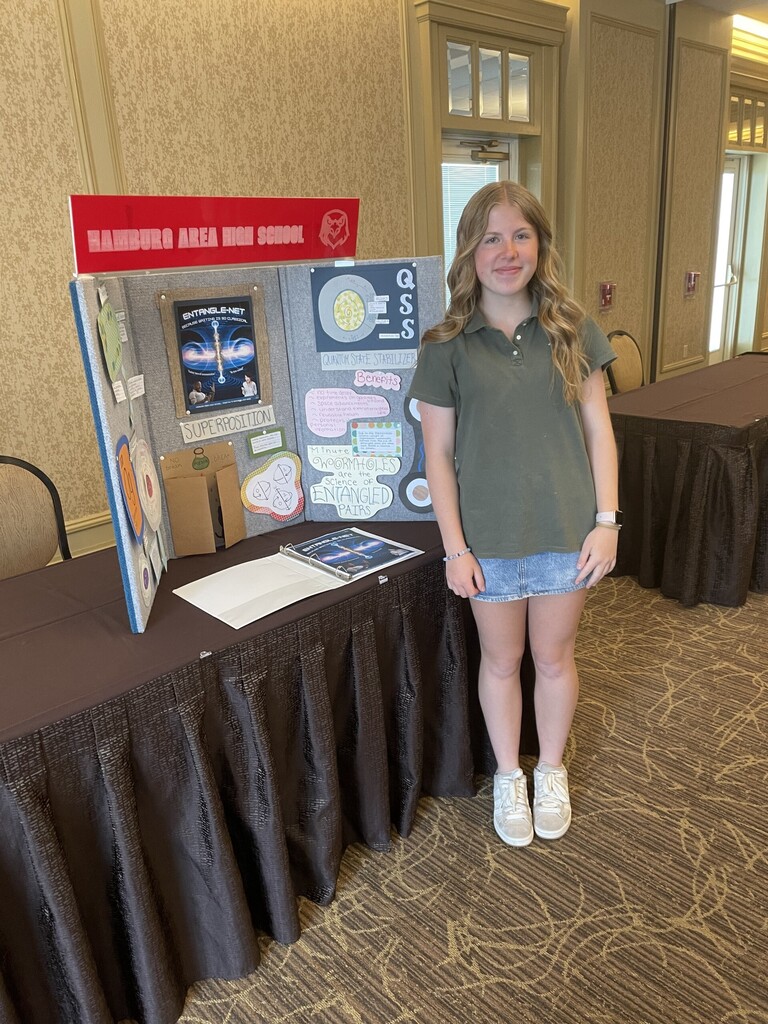 Image of a 9th grade student presenting at a chemistry conference