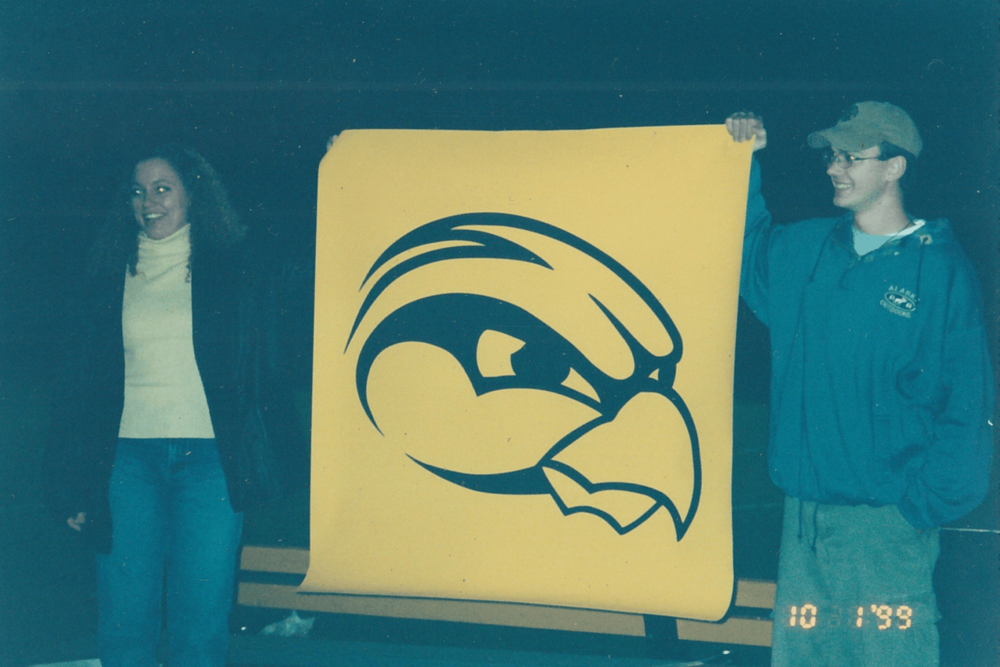 A yellow Hawkeye banner with a logo dated October 1, 1999.