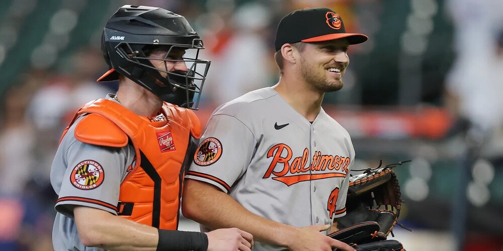 Grant Wolfram smiles after a win with the team catcher.