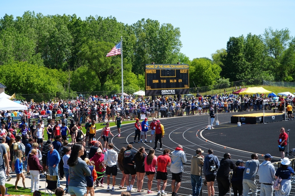 Hundreds of people gather at the Hamilton High School track.