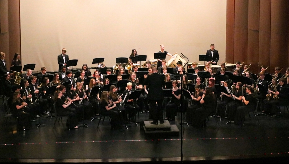 A band performs on a stage.