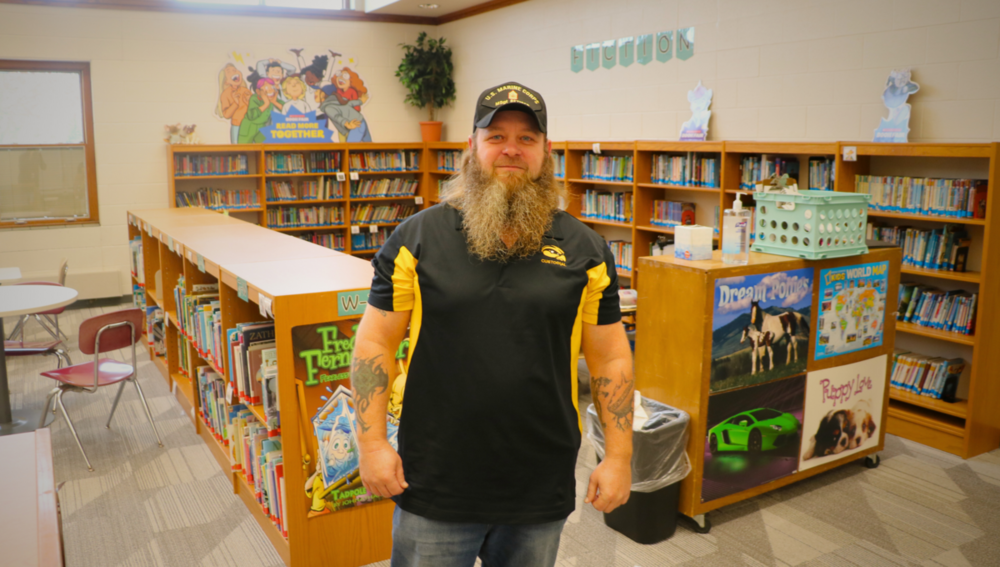 Bryan Cogar smiles in the Bentheim Elementary library.
