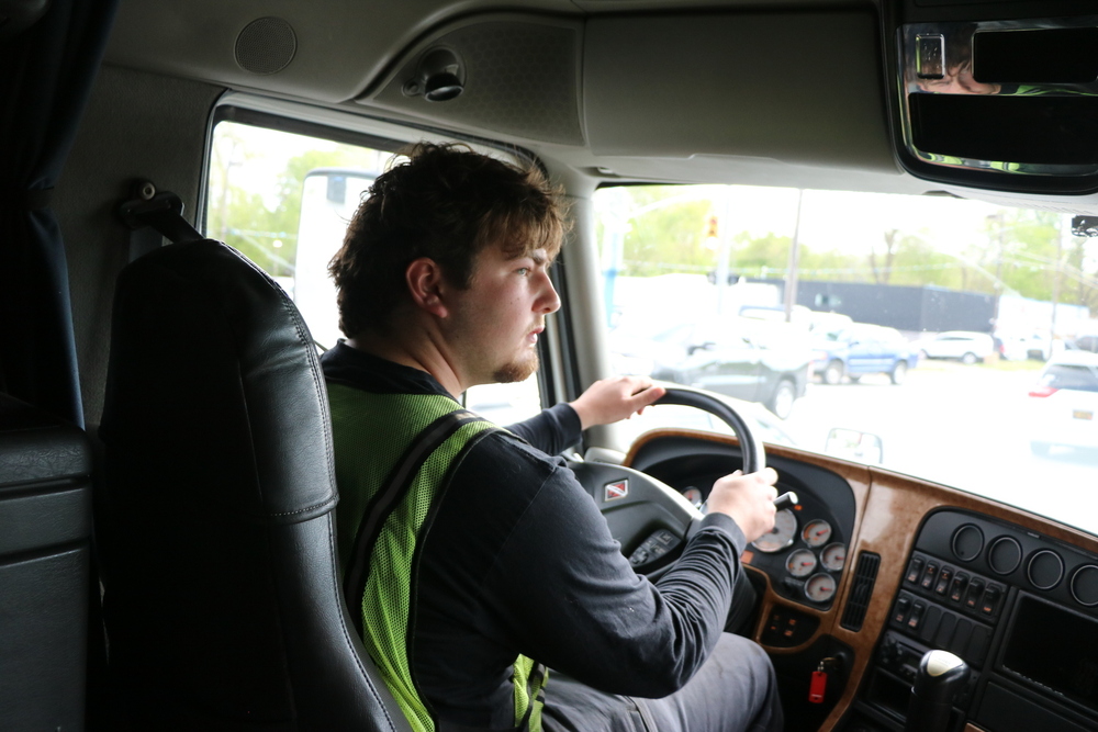 A Hamilton High School student drives a semi truck.
