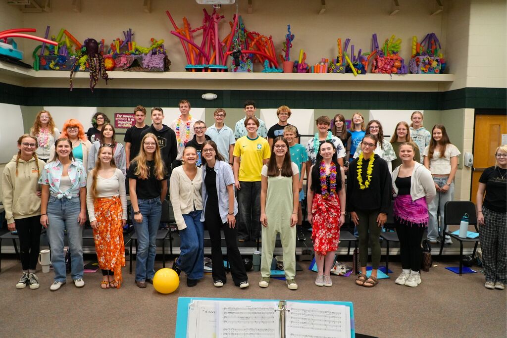Hamilton High School choirs smile in the choir room.