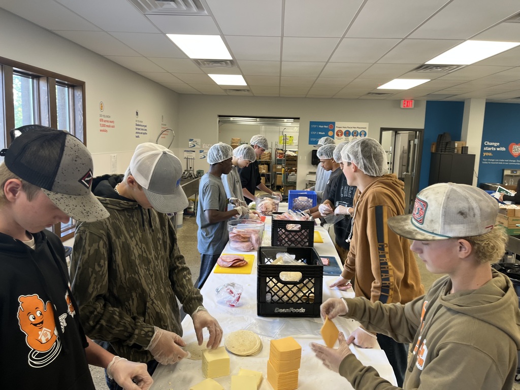 Hamilton High School Ignite program volunteers at Kids Food Basket.