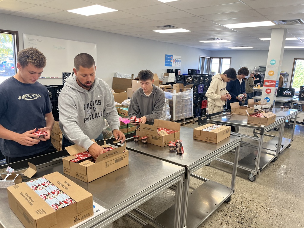 Hamilton High School Ignite program volunteers at Kids Food Basket.