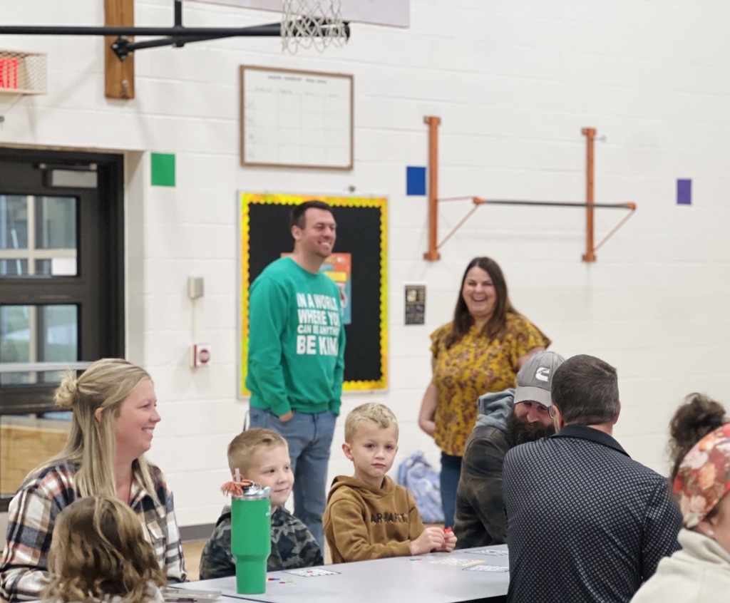 Smiles in the gymnasium at Hamilton Elementary among students and families.
