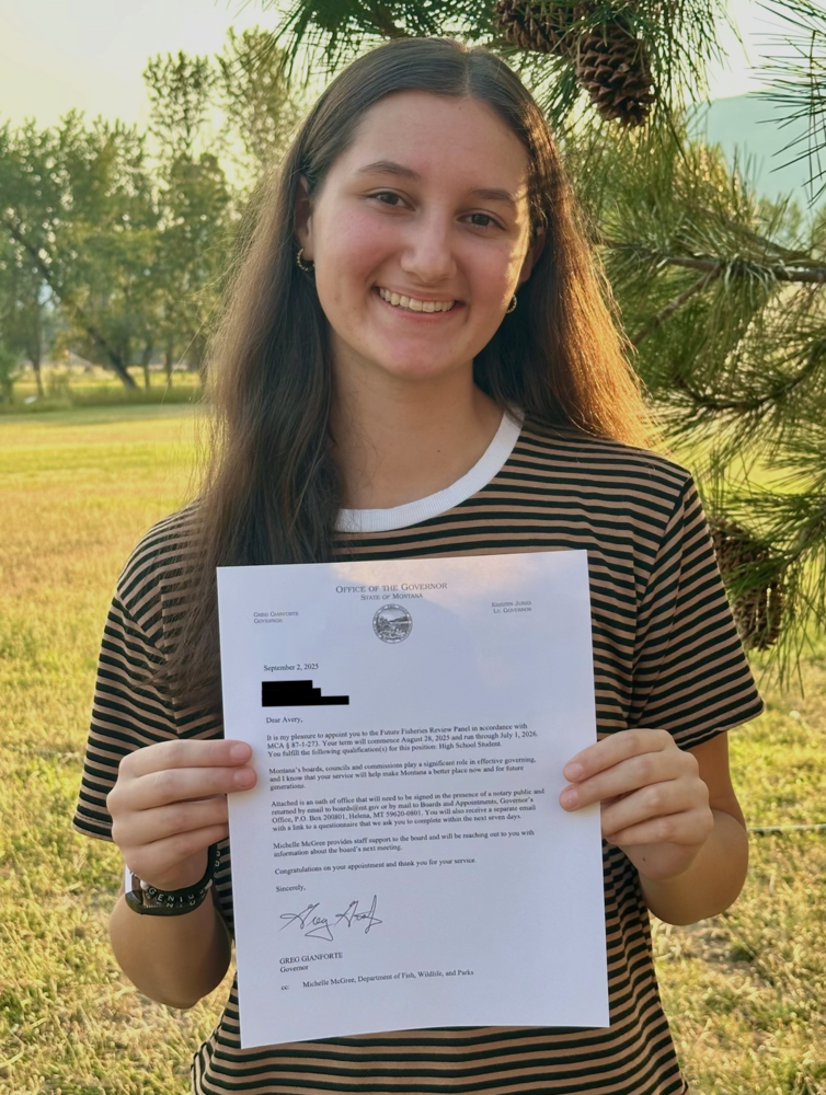 Avery Stevens holding letter