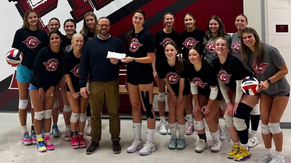Hamilton High School volleyball team pictured with Bitterroot Health Foundation director