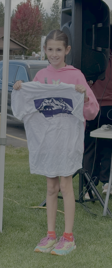 Leland Holmes receiving cross country shirt