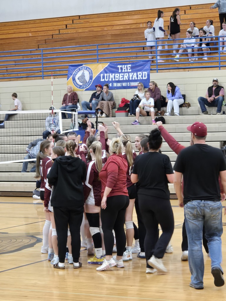 Hamilton high school girls volleyball team celebrating after their divisionals win over Columbia Falls