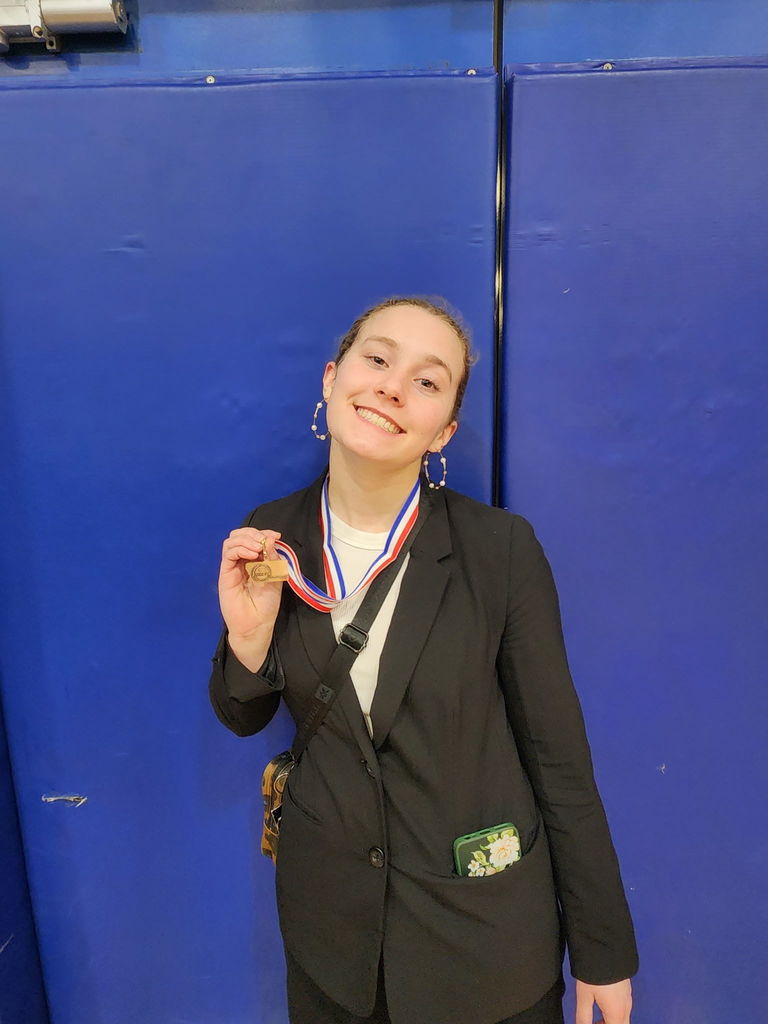 Photos of the Hamilton High School Speech & Debate team after placing 4th at the state level competition in Corvallis