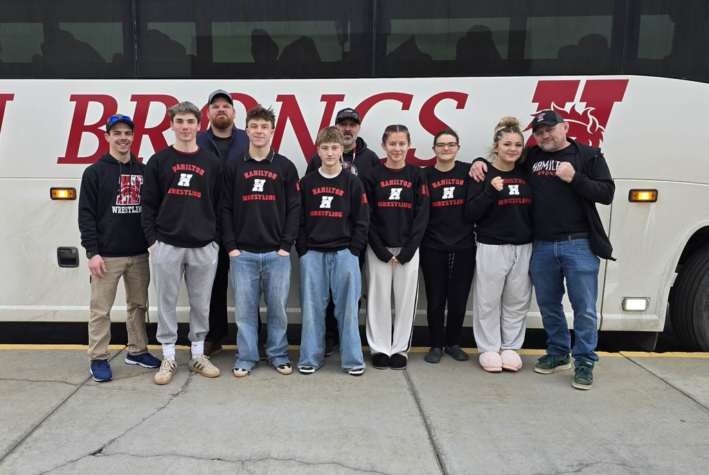 Photo of the HHS wrestling team in from of the HSD3 bus as they leave for the state wrestling competition in Billings, MT
