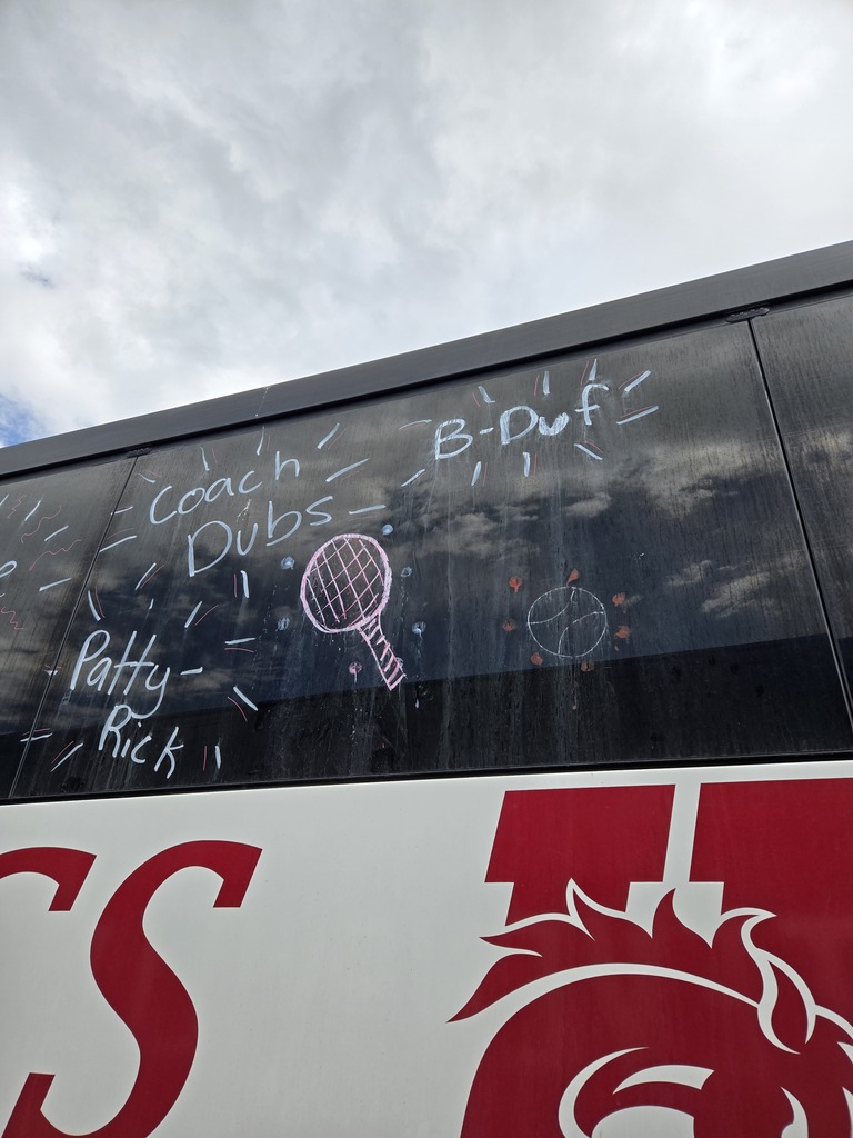 hhs bronc bus with tennis coach nicknames on windows in window paint:  Patty Rick, Coach Dubs, B-Duf
