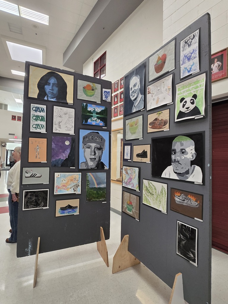 Hamilton High School art students display their works of art at the art show last week