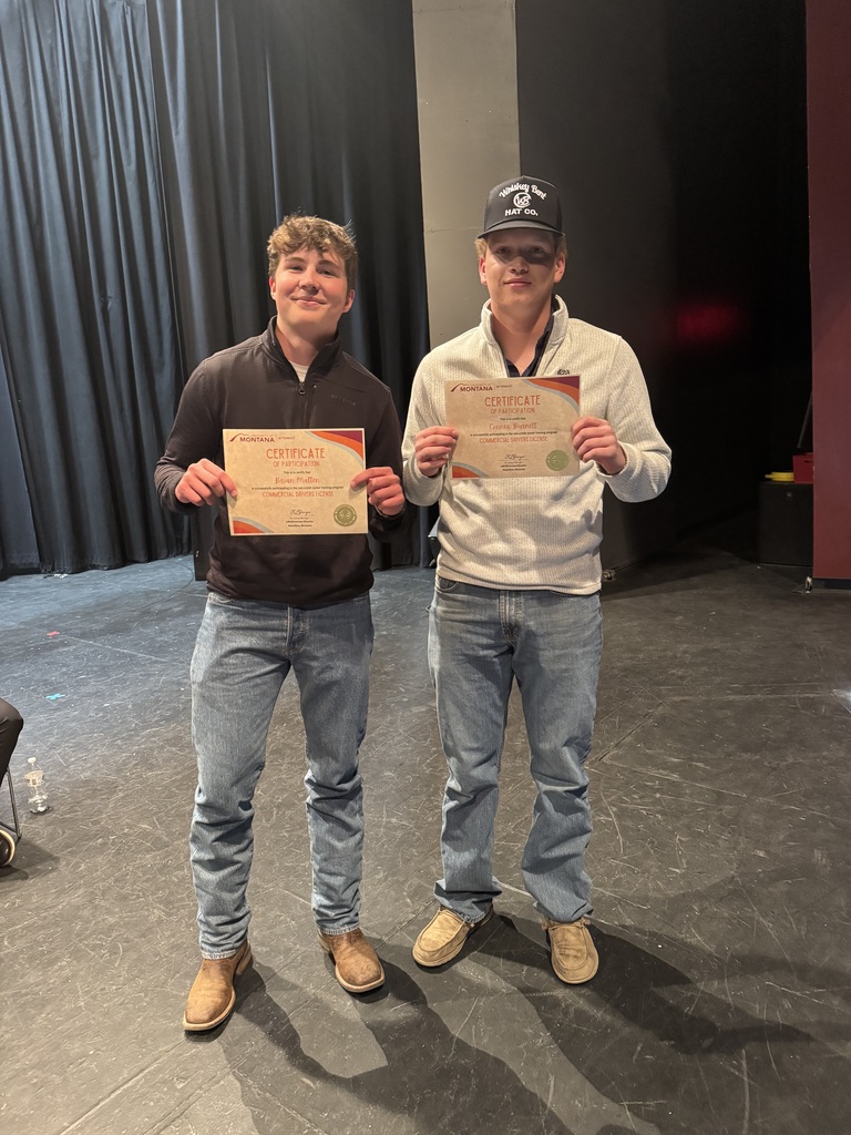 Hamilton high school students Brian Matten and Conner Burnett holding their CDL certificates