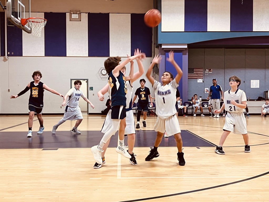 The boys B bball team playing against West Running Brook.
