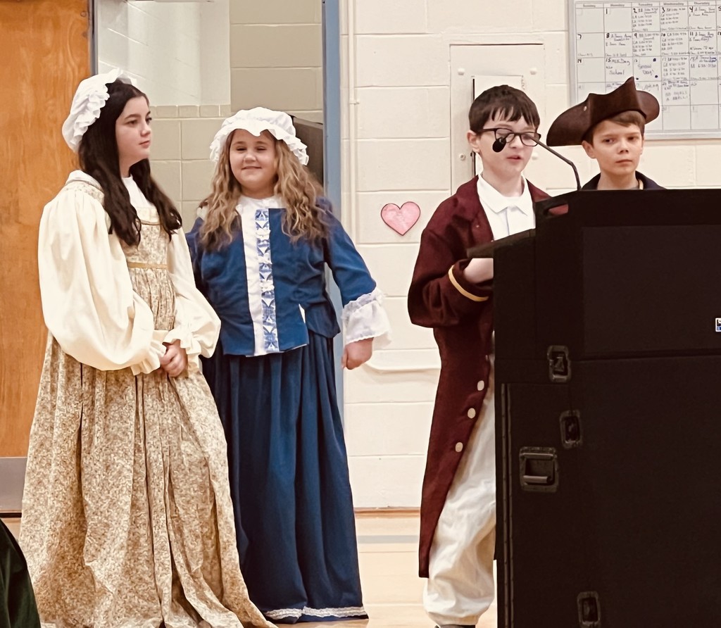 5th graders show and talk about the Hampstead slide show