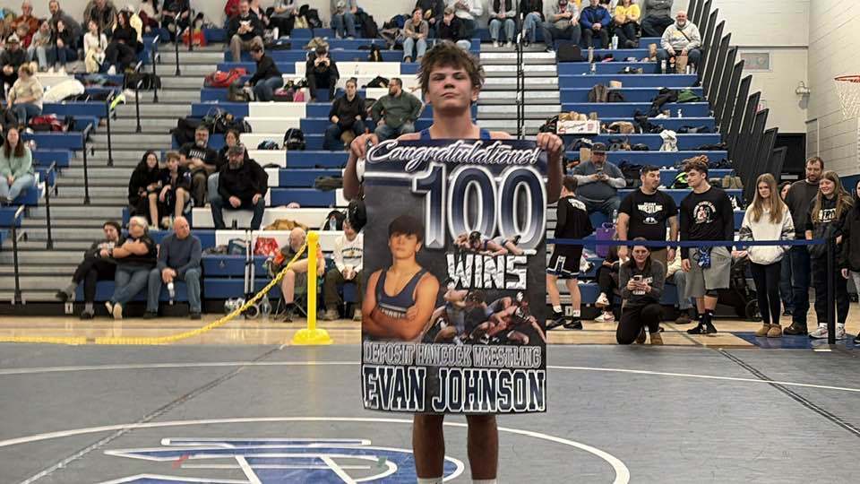 Evan Johnson 100 wins