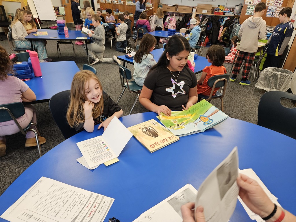 4th and 1st graders read together 4