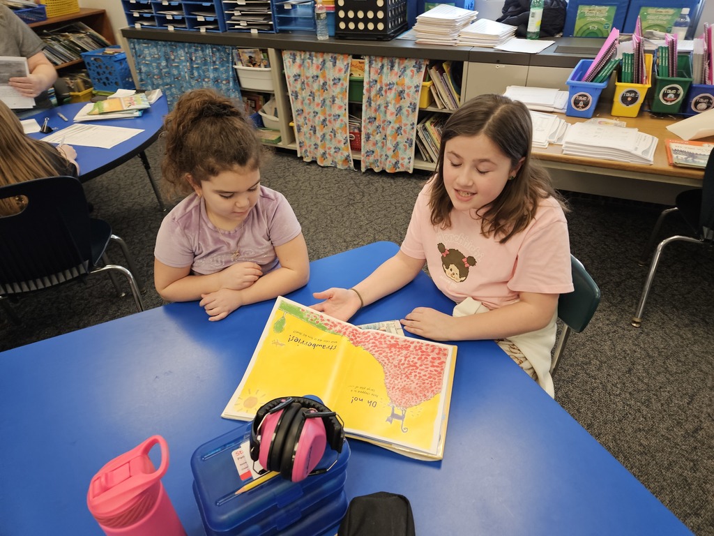 4th and 1st graders read together 1