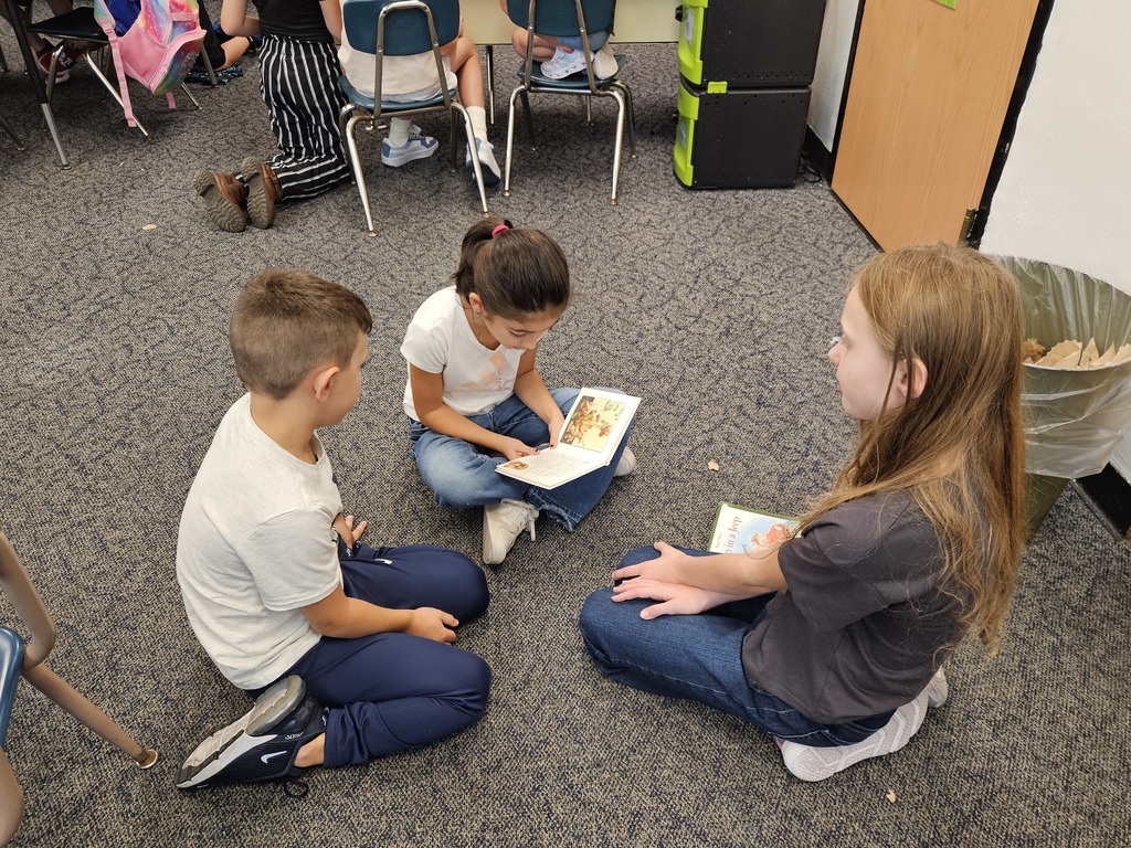 1st and 4th graders read together - 8