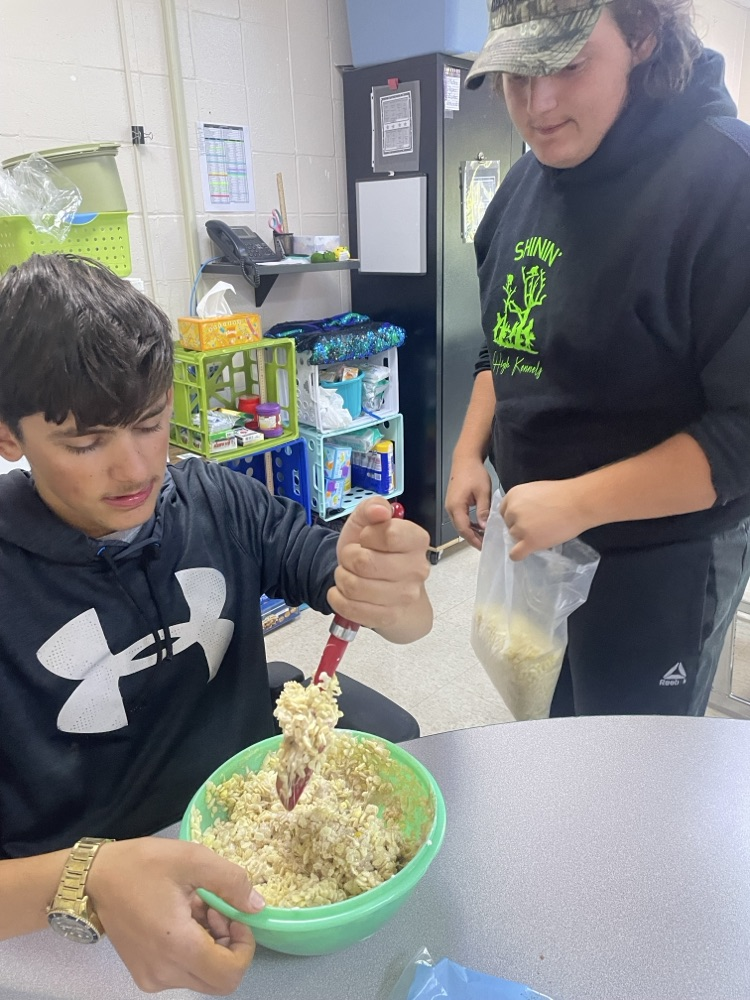 students mixing ingredients