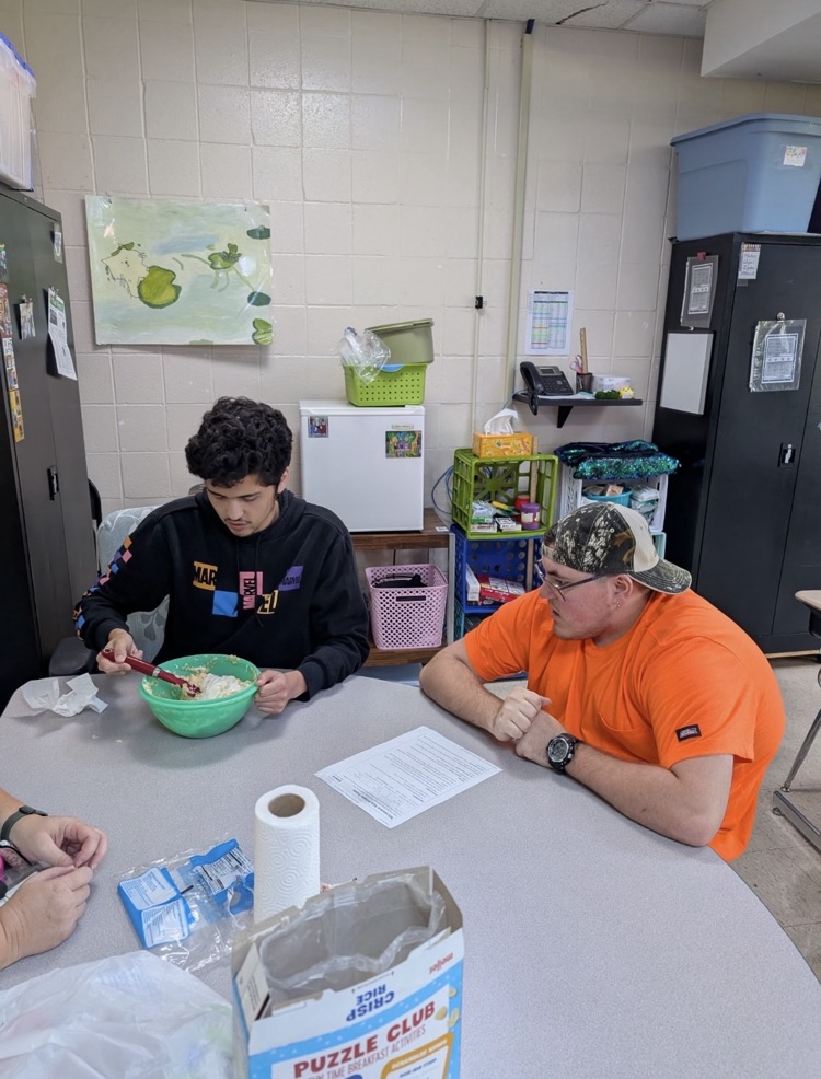 student mixing ingredients