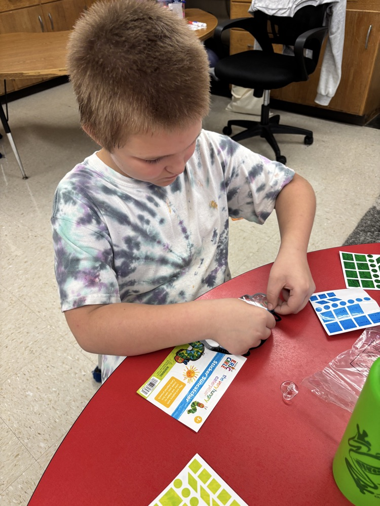 student making sun catcher