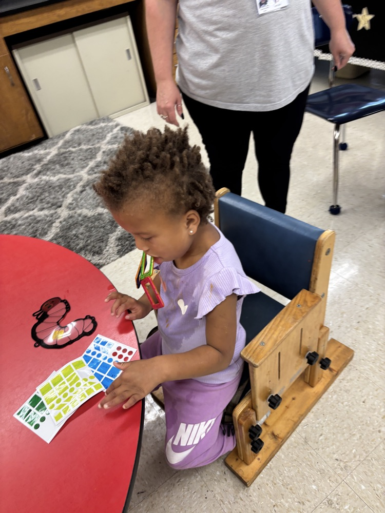 student making sun catcher