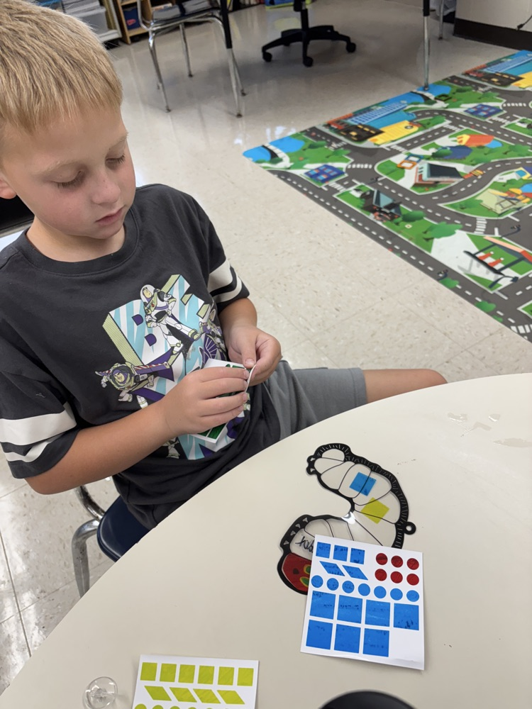 student making sun catcher