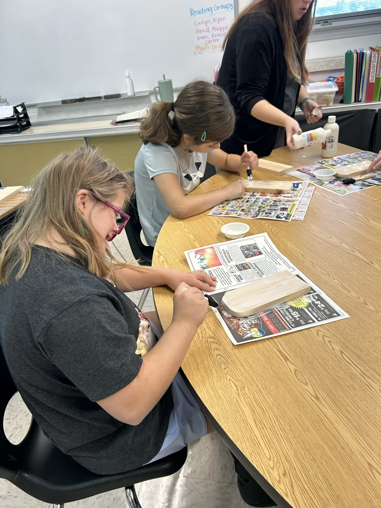 students painting