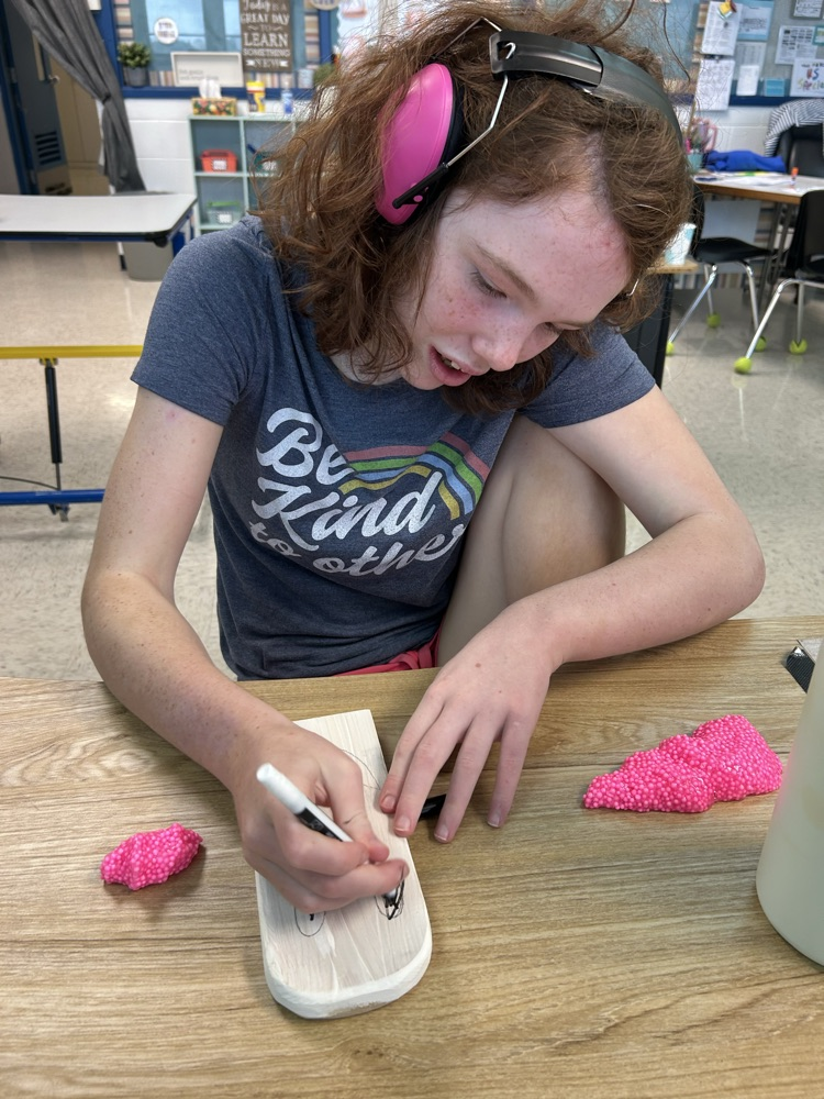 student drawing ghost face