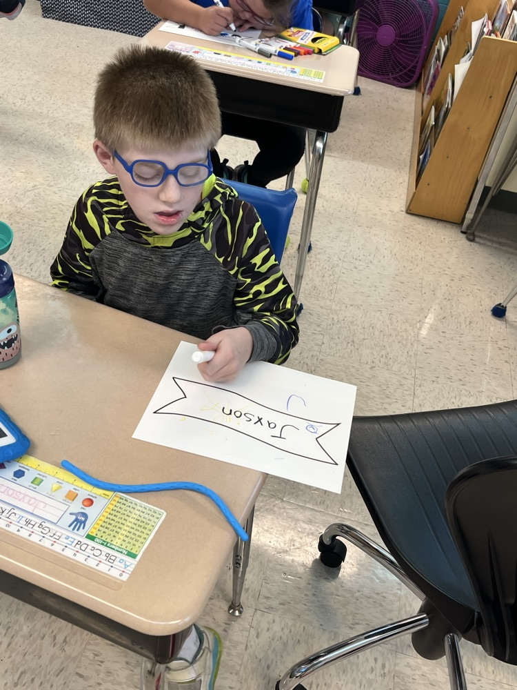 student working on banner