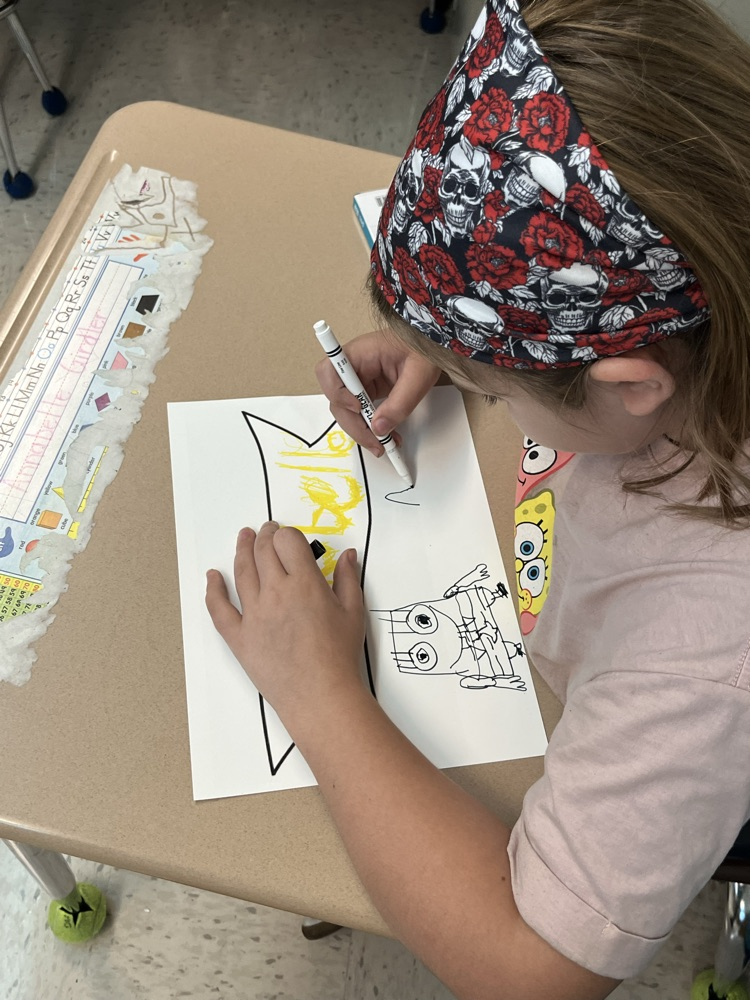 student working on banner