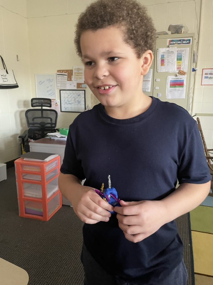 student with playdoh bug