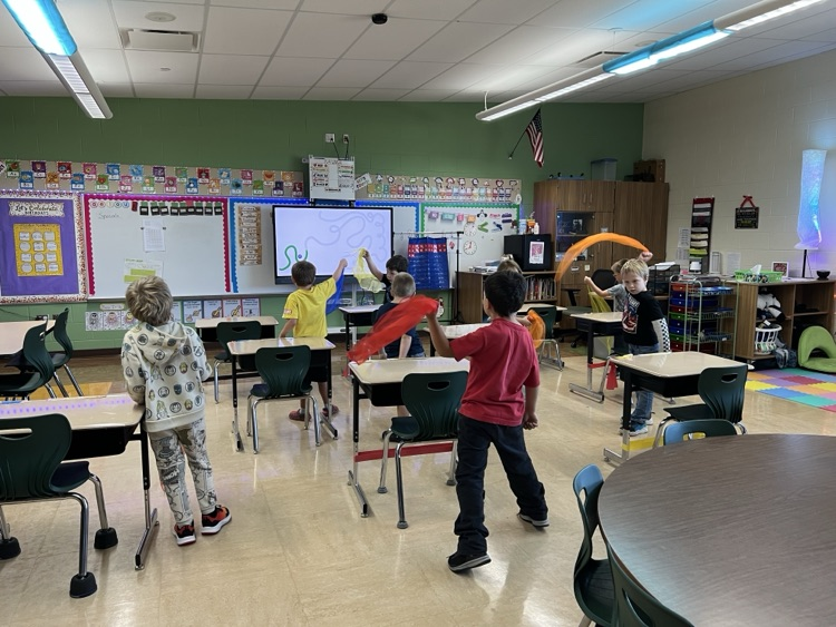 students dancing with scarves