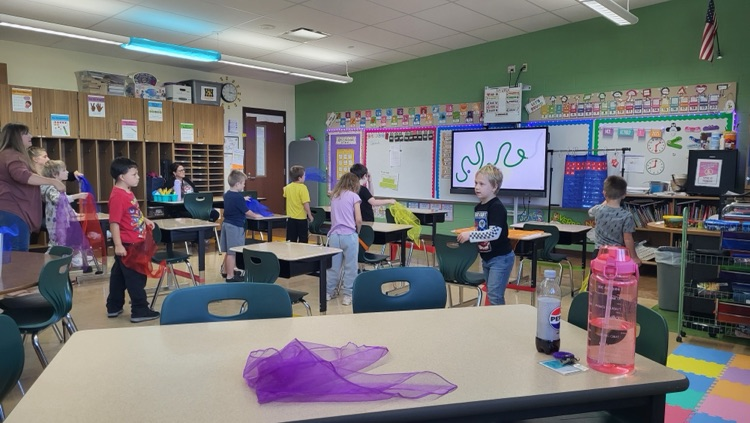 students dancing with scarves