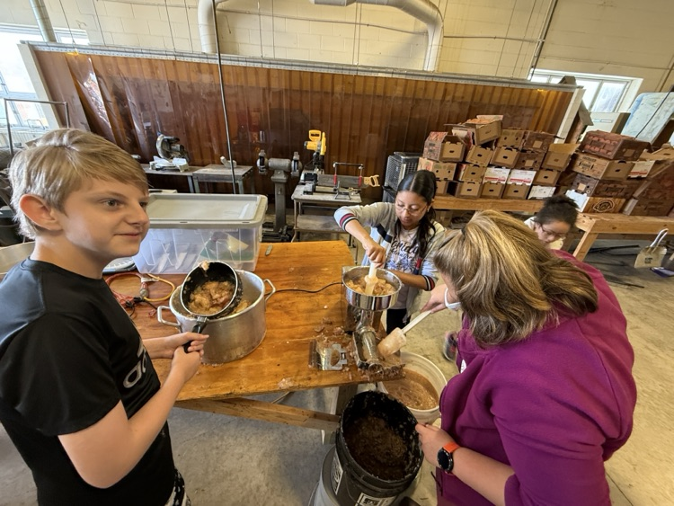 students making apple butter
