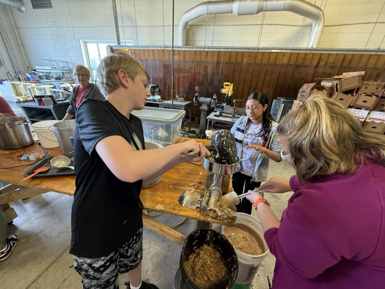 students making apple butter
