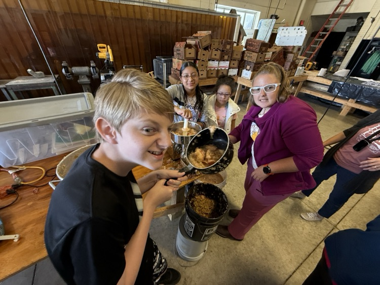 students making apple butter