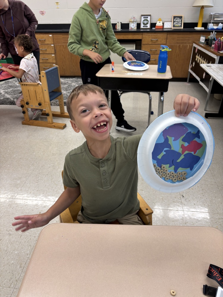 student with their aquarium